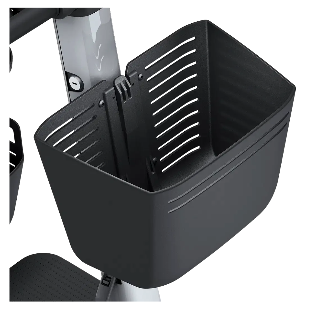 Close-up of the Front Basket for Whill Model R scooters, a modern black plastic accessory with horizontal ventilation slits and a sleek, rectangular design securely attached to the scooter frame.